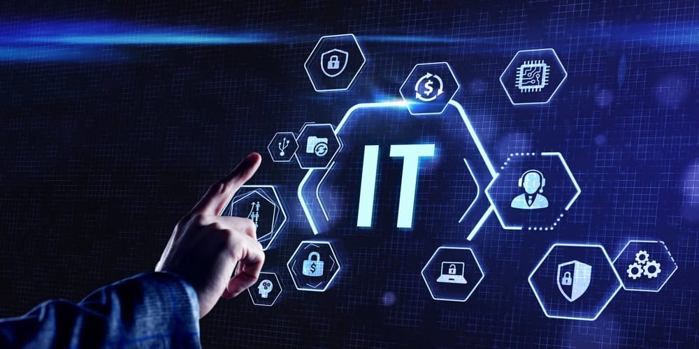 A person points at a glowing display showing IT Support in Indianapolis, surrounded by tech icons like security, USB, and microchip.