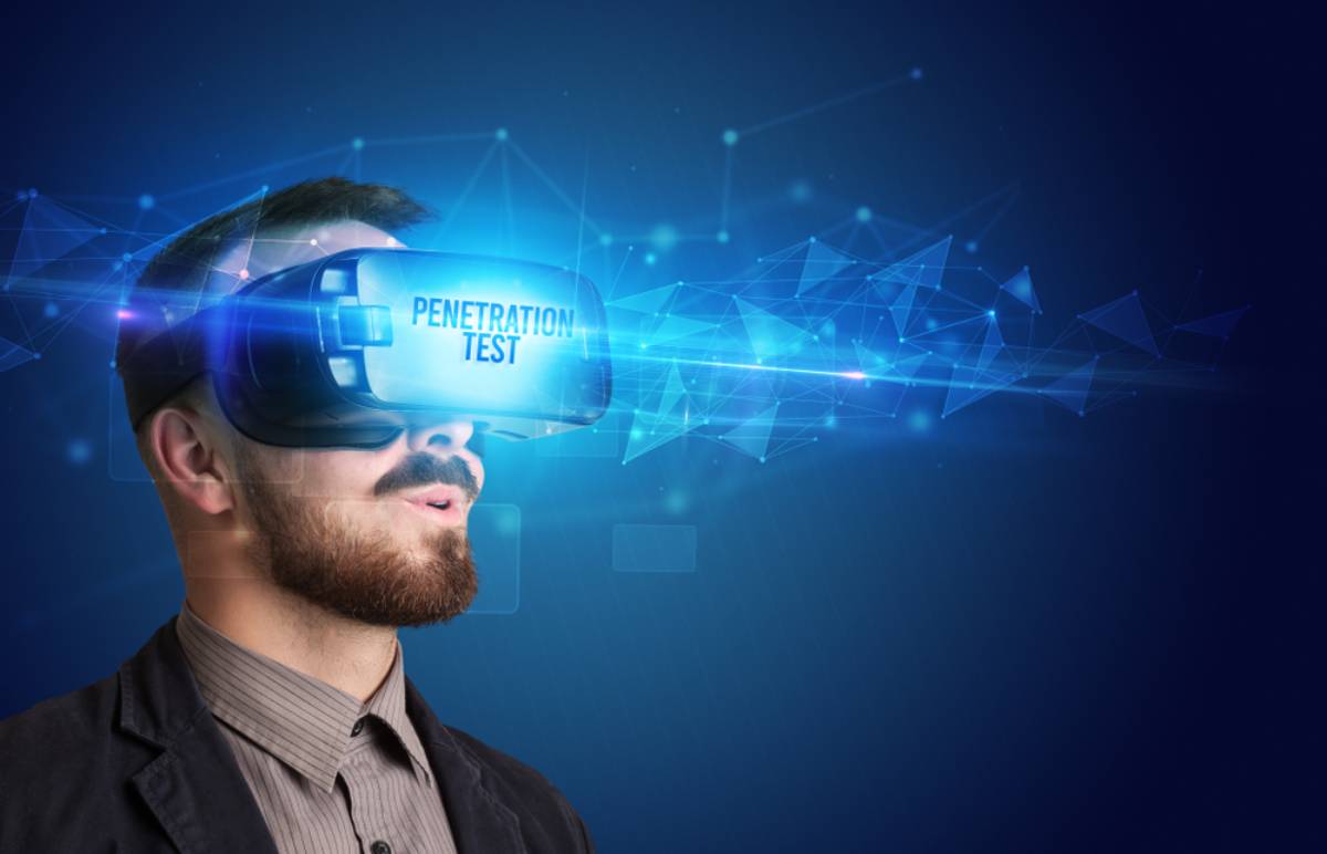 A man wearing a virtual reality headset displaying the words "PENETRATION TEST," with digital network graphics and blue light effects emanating from the headset against a dark background.